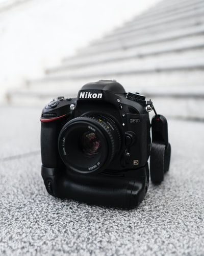 black Nikon DSLR camera
